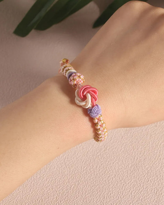 Bracelet with knot of peach blossoms