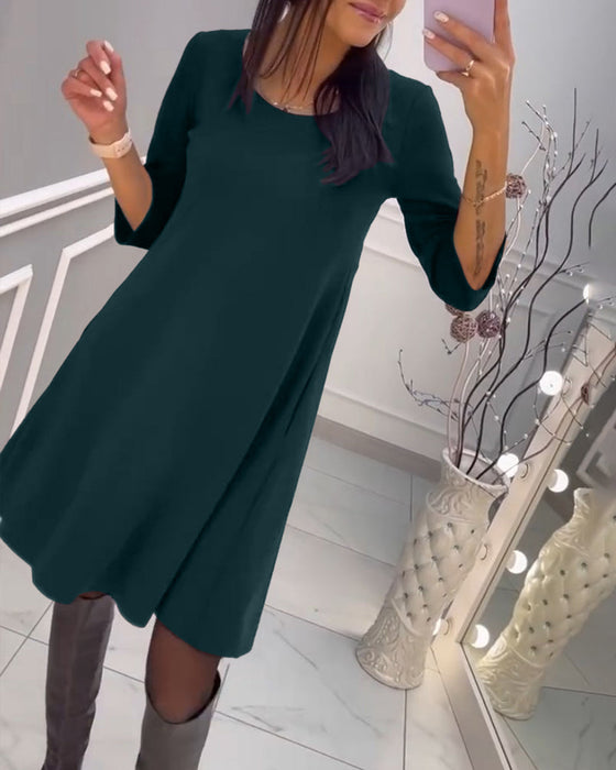 Solid color dress with bow at back