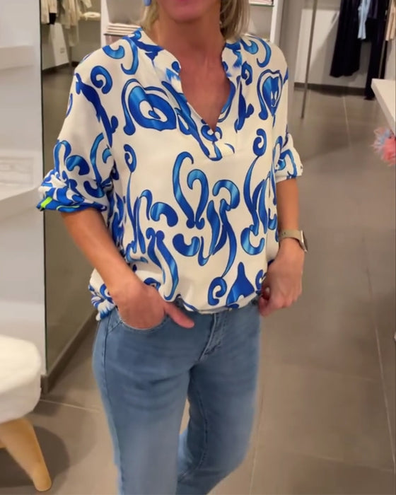 Elegant long-sleeved top with printed V-neck