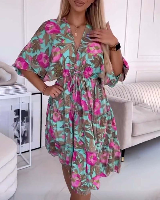 Elegant dress with drawstring ties and floral print