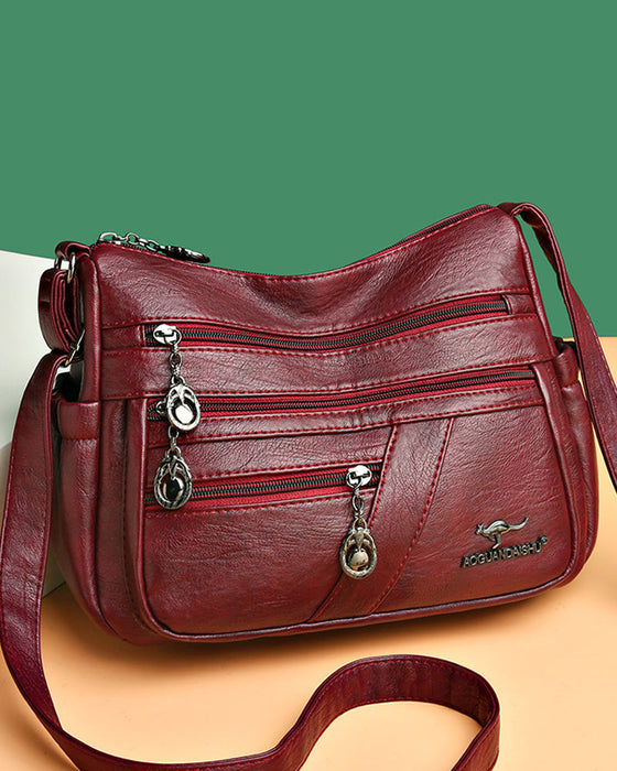 Multi-pocket soft leather crossbody bag