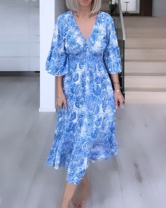 V-neck belted printed flowy dress