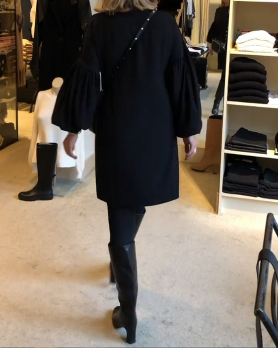 Classic black dress with lantern sleeves
