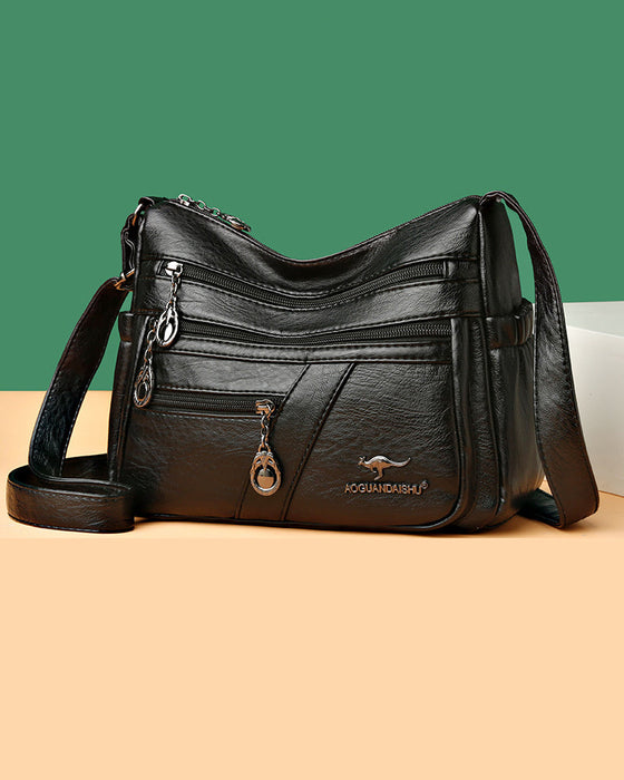 Multi-pocket soft leather crossbody bag