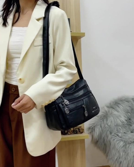 Multi-pocket soft leather crossbody bag