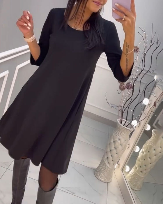 Solid color dress with bow at back