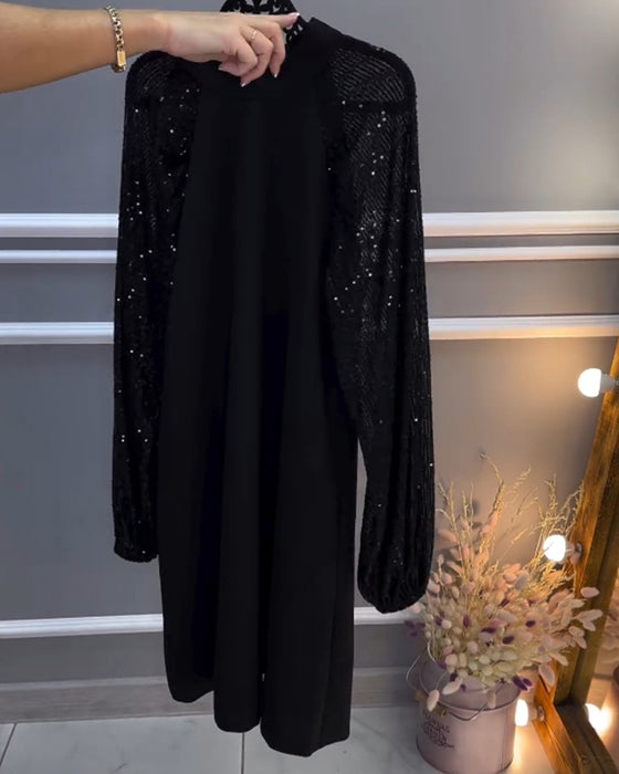 Solid color dress with patchwork sleeves